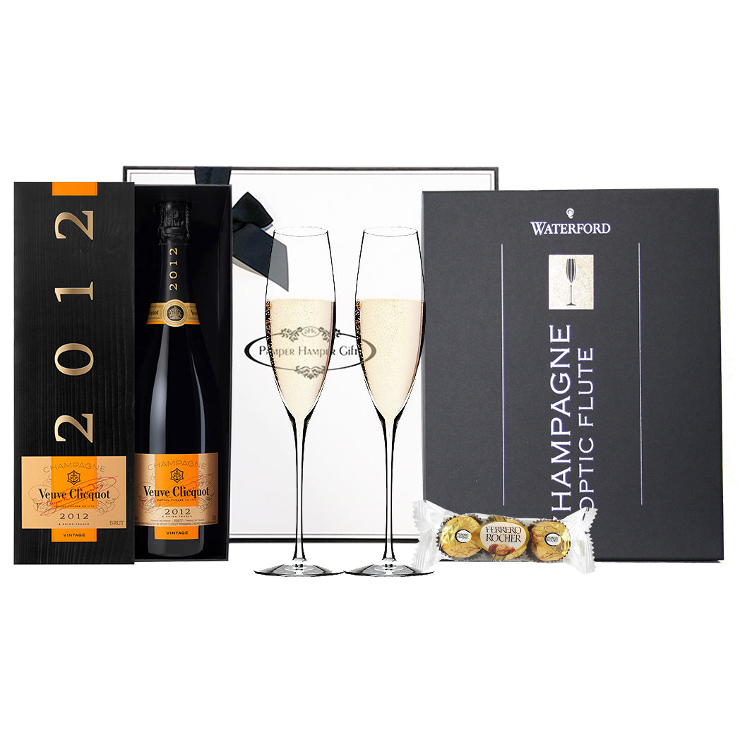 Veuve Clicquot Champagne 2012 Boxed, Waterford Crystal Champagne Elegance Classic Flute and Ferrero Rocher triple pack chocolates.  Beautifully packaged in our signature gift box.